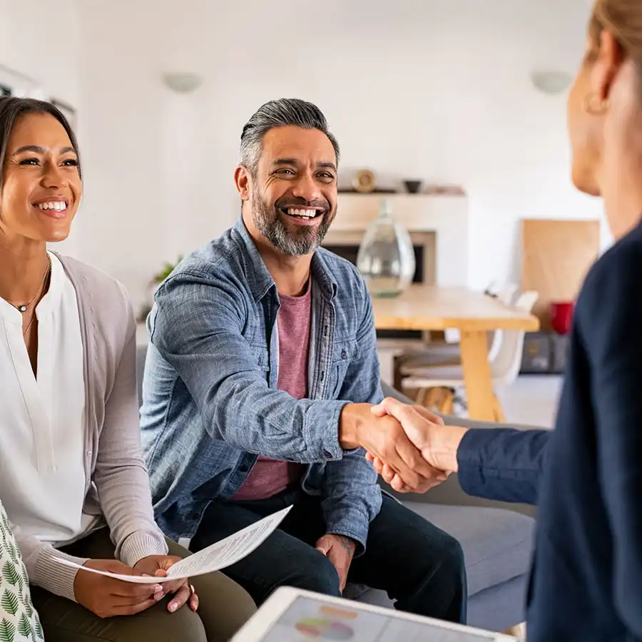 middle-aged couple meeting with an insurance agent
